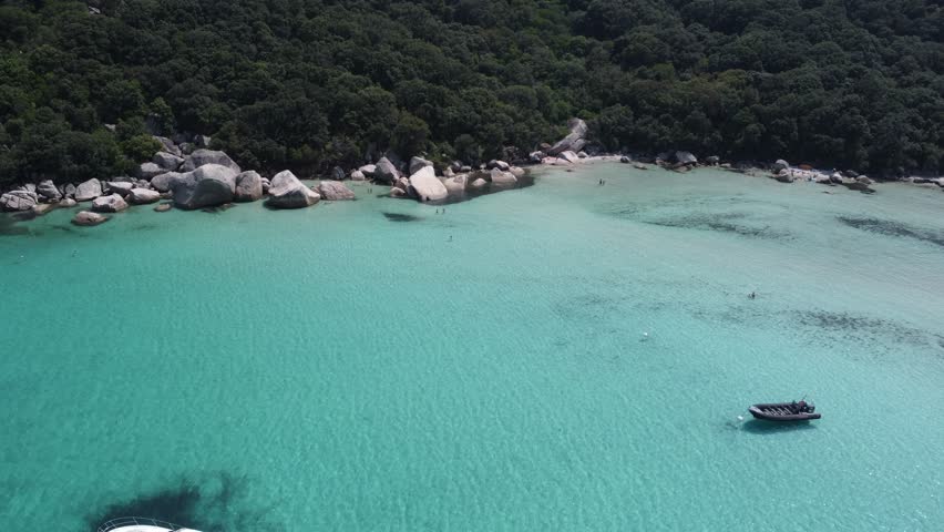 Beautiful rocks in clear water drone shot, Plage de Santa Giulia, Corsica