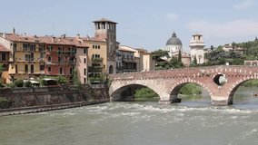 Ponte Pietra bridge over Adige River in Verona with cathedral bell tower  - Powered by Shutterstock - Get 15% off with code: PIKWIZARD15