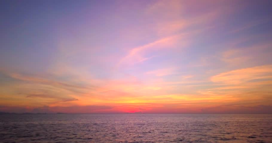 Aerial panoramic view of sunset over ocean. Colorful sky clouds water. Beautiful serene scene, wide angle seascape. Drone view, majestic stunning nature background. Best sea sky sunrise. Inspire views