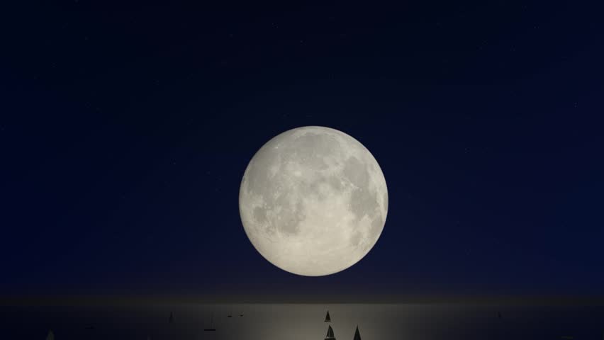 This video shows a full moon setting over the sea. The dark sky is filled with stars, and the silhouettes of sailboats are visible on the horizon. The moonlight reflects on the water, creating a