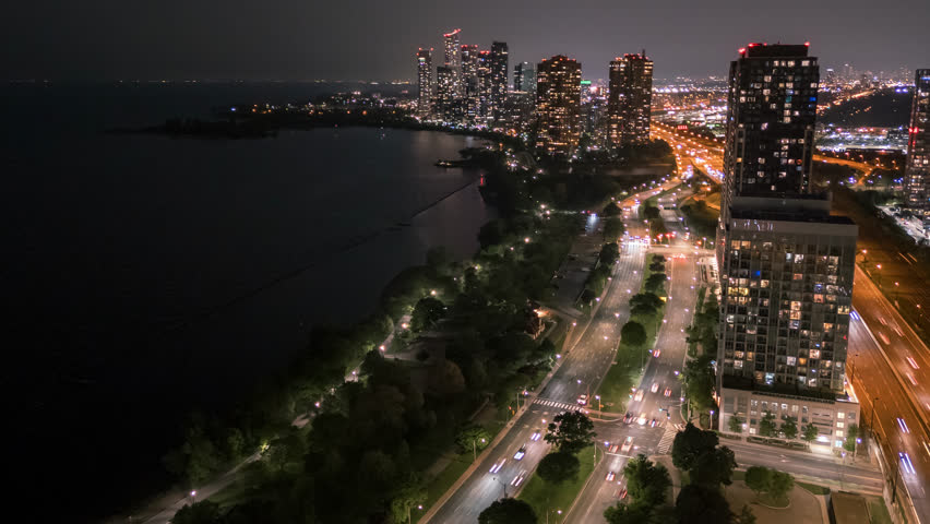 Aerial Hyperlapse Of Parklawn Neighbourhood Skyline At Night Near Downtown Toronto, Canada.