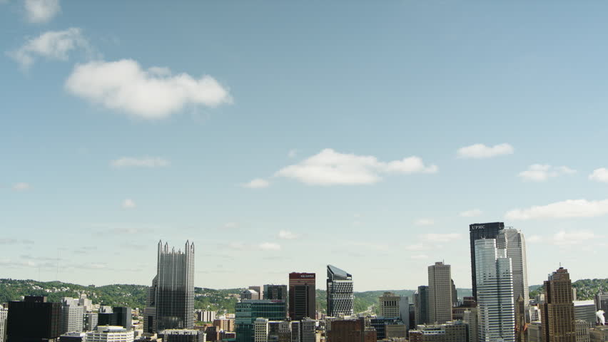 Pittsburgh City Skyline Reveal on Bright Sunny Day, Tilting Down