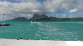 Boats Sailing in Bora Bora Lagoon, Turquoise Water and Volcanic Island, Passenger Point of View - Powered by Shutterstock - Get 15% off with code: PIKWIZARD15