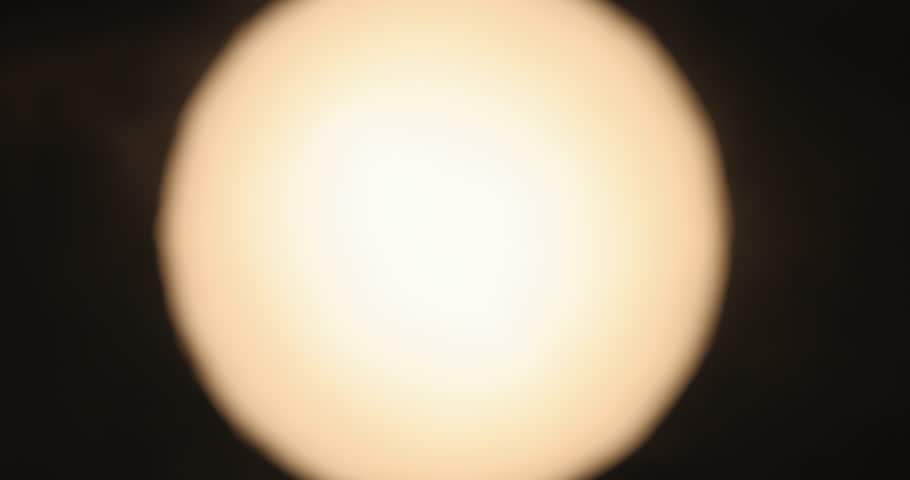 Silhouette of two hands forming heart shape against bright sun background symbol of love romance unity hope 4K slow motion macro video