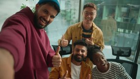Web cam POV four multiracial colleagues informal business team making selfie photo posing together happy smiling showing thumbs up casual corporate friends in coworking office video call live vlog - Powered by Shutterstock - Get 15% off with code: PIKWIZARD15