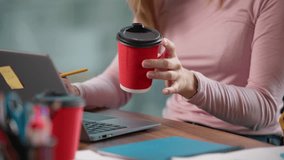 Caucasian happy businesswoman in office business meeting drinking tea coffee writing notes typing laptop computer corporate software technology smile working with colleagues in informal startup team - Powered by Shutterstock - Get 15% off with code: PIKWIZARD15