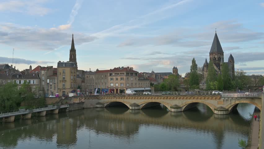 Cityscape of Metz with the river Moselle and the so called Temple Neuf Church at sunset - France