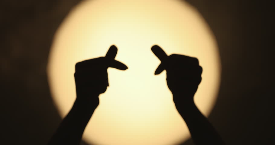 Hands Forming Heart Shape Silhouette Against Full Moon Light