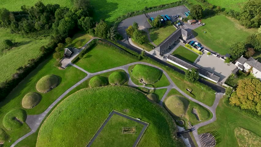 Beautiful drone view of Neolithic monument Knowth in Ireland. Green mounds and tombs.
