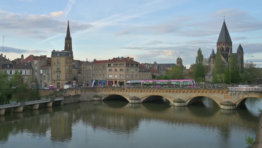 Cityscape of Metz with the river Moselle and the so called Temple Neuf Church at sunset - France