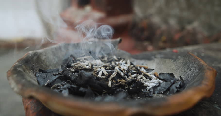 Traditional incense smoke rises during a prayer by a devotee in Nepal. Captured at Buddhist sites like Swayambhu and Boudhanath, the ritual symbolizes devotion, ceremony, and cultural spirituality