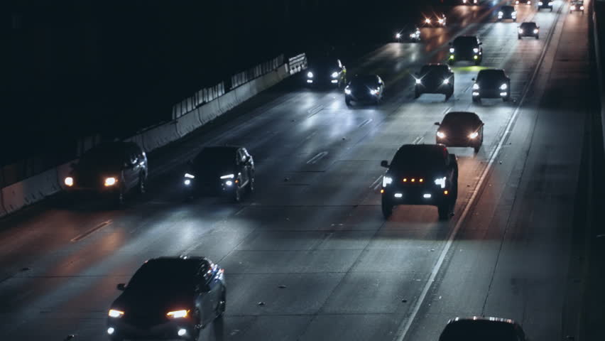 Hi-res clip of a freeway at night in Los Angeles. Captures the steady flow of traffic with crisp detail. Ideal for projects related to urban life, transportation, commuting and infrastructure.
