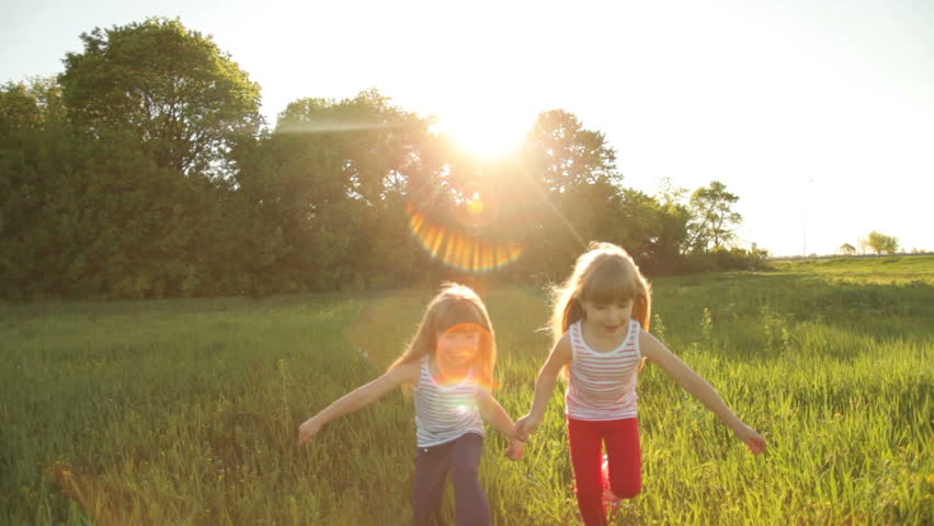 Two girls are playing catch-up with flare 
