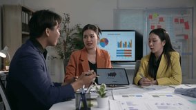 Corporate professionals analyzing business data collaboratively, using digital tablet during strategic team meeting in modern Asian office environment - Powered by Shutterstock - Get 15% off with code: PIKWIZARD15