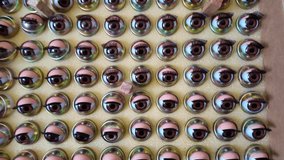 Creepy background video of doll eyes blinking inside a box, surreal spooky abstract concept - Powered by Shutterstock - Get 15% off with code: PIKWIZARD15