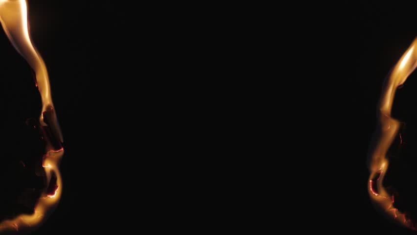 Burning paper, glowing edge of paper on a black background. Mockup for your logo. Wide angle horizontal wallpaper or web banner. flame effects for overlay designs or screen blending mode to make high.