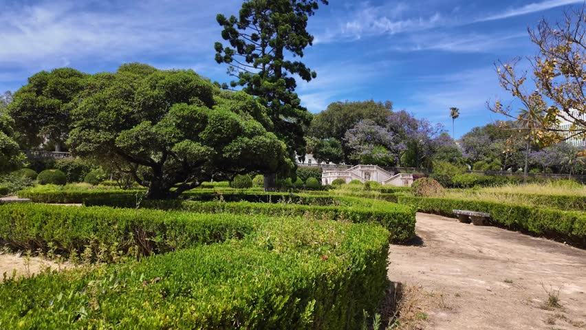 Sunny day Lisbon city park POV walking green trees Europe travel concept architecture background