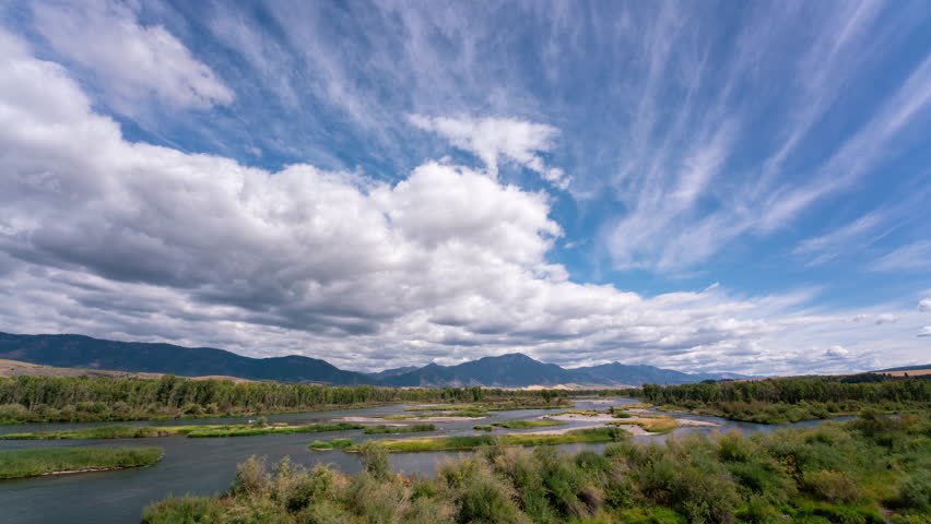 Timelapse of clouds moving through the landscape over the Snake River in Swan Valley Idaho.