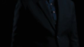 A businessman holds a visual representation of secure data management, featuring a digital lock symbol and various tech elements in a dark setting, emphasizing cybersecurity. Qubit - Powered by Shutterstock - Get 15% off with code: PIKWIZARD15