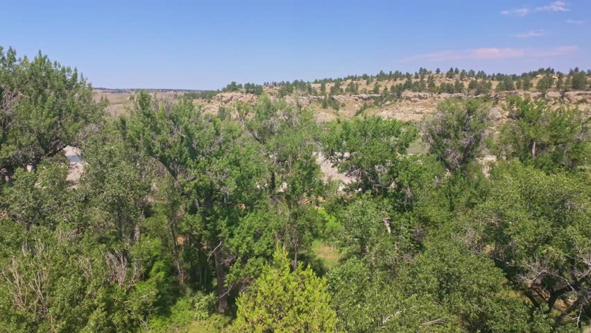 A scenic view of the Yellowstone River Valley from Pompeys Pillar National Historic Monument, highlighting the historic sandstone butte