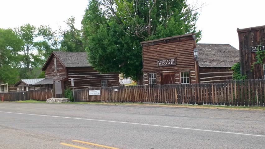 A collection of old, vintage wooden buildings captured at the Nevada City Living History Museum in Montana on summer day