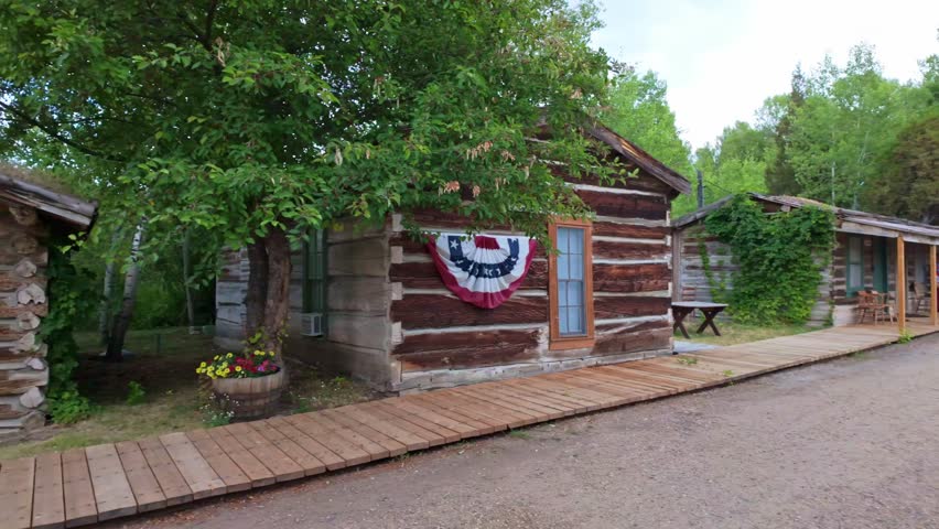 A collection of old, vintage wooden buildings captured at the Nevada City Living History Museum in Montana on summer day