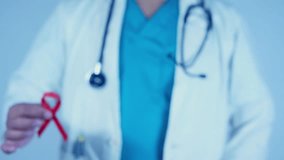 Red ribbon symbol. World AIDS day awareness ribbon. Concept of health care and treatment. Care and support for people with AIDS.
Doctor hold red ribbon awareness - Powered by Shutterstock - Get 15% off with code: PIKWIZARD15