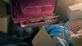 Attic Interior With Trumpet And Sports Items In Boxes - Powered by Shutterstock - Get 15% off with code: PIKWIZARD15