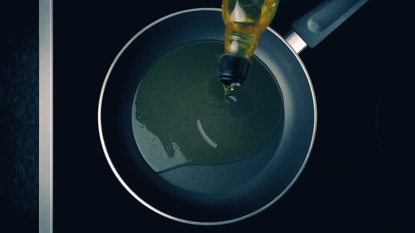 Cooking Oil Pours Into Pan On Hob