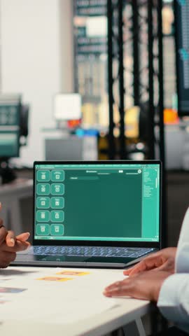 Vertical Video HR professionals relying on AI driven tech systems with smart algorithms to filter applicant profiles and identify potential candidates after all job interviews in a corporate office