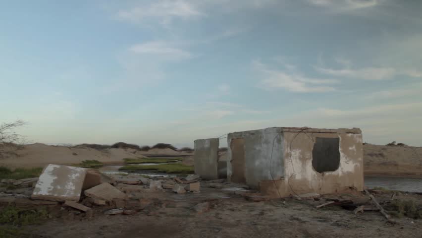 Long shot of white house ruins in the ghost town of Puerto , northern Guajira, Colombia.