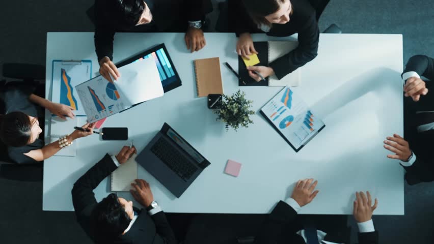 Top view of smart project manager use VR headsets to enter virtual world and analyze data at meeting while business people working on financial document and brainstorm marketing idea . Directorate. - Powered by Shutterstock - Get 15% off with code: PIKWIZARD15