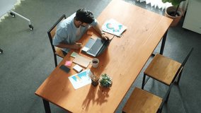 Top view of caucasian businessman walking and stared work at meeting room. Business team working together to analysis financial graph at table with sticky note and document placed on it. Convocation. - Powered by Shutterstock - Get 15% off with code: PIKWIZARD15