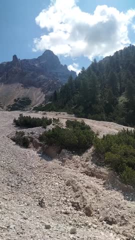 Barren rocky peaks in the high mountains, no trees, no grass—just endless stone under a vast sky. Harsh, silent, and majestic like a mountain desert.