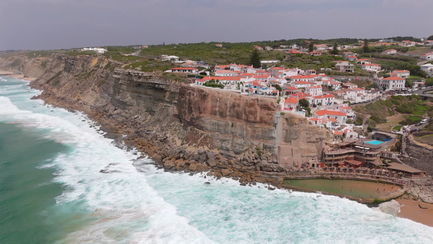 Discover the breathtaking beauty of Azenhas Do Mar Beach, an enchanting coastal village located in the picturesque region of Sintra, Lisbon, where natures splendor meets incredible scenic landscapes
