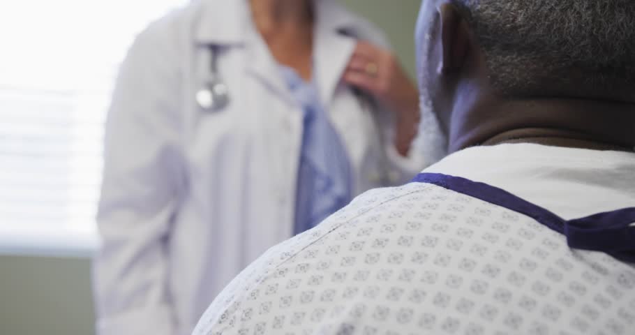 Doctor initiating medical code overlay tracking patient vitals then providing shoulder reassurance. Futuristic, healthcare, technology, professionalism, clinical, diagnostic, support