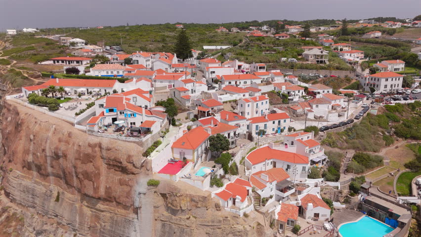 Discover Azenhas Do Mar Beach in Sintra, Lisbon, with stunning coastal views and charming architecture. Perfect for photographers and travelers, its a blend of nature, adventure, and tranquility
