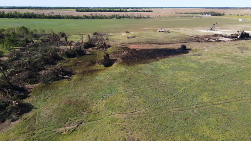 Aerial view over fallen trees, Tornado destruction in Kansas, USA, sunny day