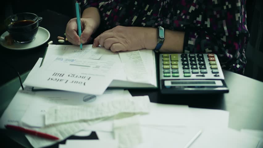 Household Accounting And Business Administration, Serious Financial Decision Making Careful Expense Analysis. Tax Documents And Utility Bills, Overwhelmed By Paperwork And Bills. Personal Finances