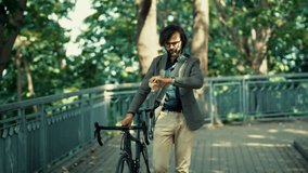 Businessman In Blazer And Glasses Walking With Bicycle In Green Park. Modern Urban Professional Commuting To Work. Freelancer Taking A Break Outdoors. Daily Commute, Sustainable Transportation - Powered by Shutterstock - Get 15% off with code: PIKWIZARD15