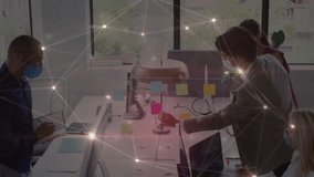 Network overlay fading sparking masked team arranging sticky notes on divider for business planning. Collaboration, teamwork, office, planning, digital, innovation, professional - Powered by Shutterstock - Get 15% off with code: PIKWIZARD15