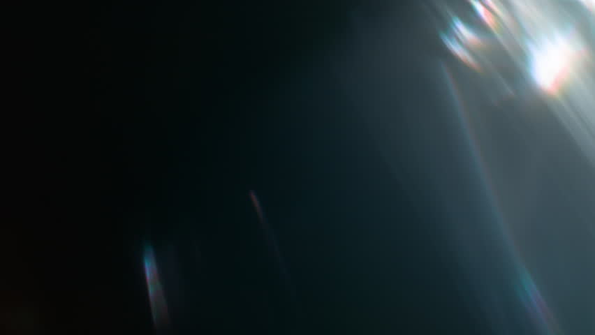Real Shooted Cinematic Lens Flare Overlay on Black Background at 1000fps Slow Motion.
