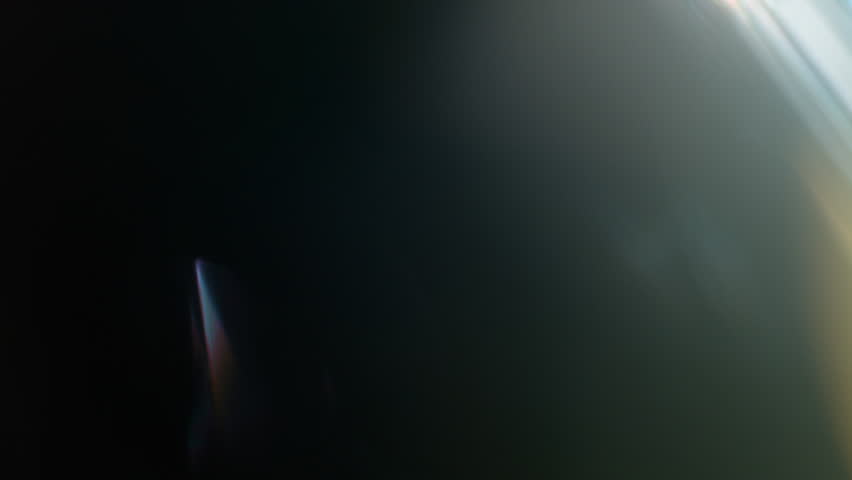 Real Shooted Cinematic Lens Flare Overlay on Black Background at 1000fps Slow Motion.