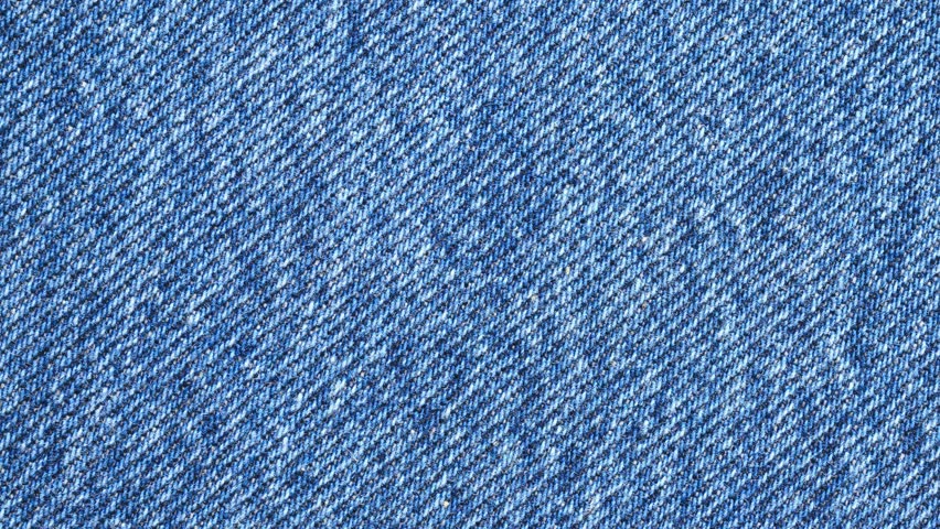 Old denim blue jeans fabric texture background stop motion