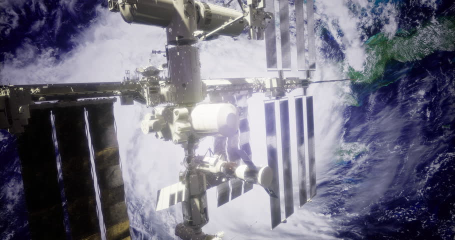 The International Space Station floats above Earth, showcasing its structure against the backdrop of swirling clouds and vast ocean. The view highlights its significance in space exploration.