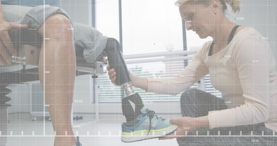 Patient flexing knee following data overlay while clinician adjusting pylon, tracing red line graph. Prosthetics, rehabilitation, gait, mobility, therapy, assistivetechnology, healthcare