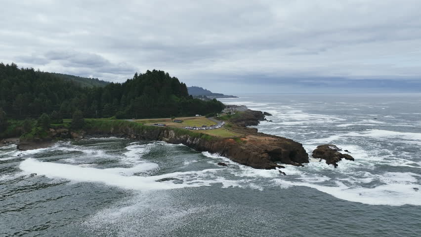 Drone circling the Boiler Bay State Scenic Viewpoint, cloudy day in Oregon, USA