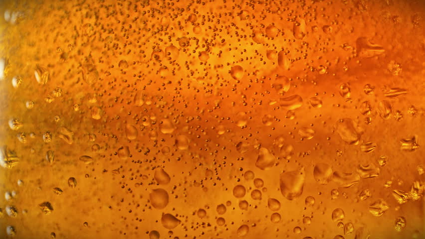 Super Slow Motion of Bubbling Beer Background at 1000fps.