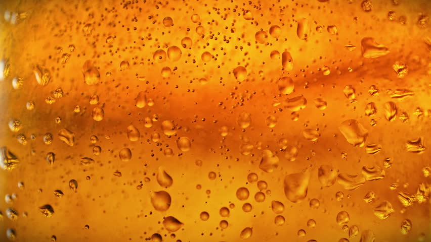 Super Slow Motion of Bubbling Beer Background at 1000fps.