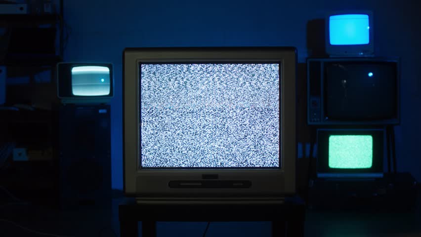Vintage television set displaying colorful static retro styled. Glitch art tv concept with nostalgic vibe. Visuals relating technology failure. old school decor. Past time. multiple television Screen
